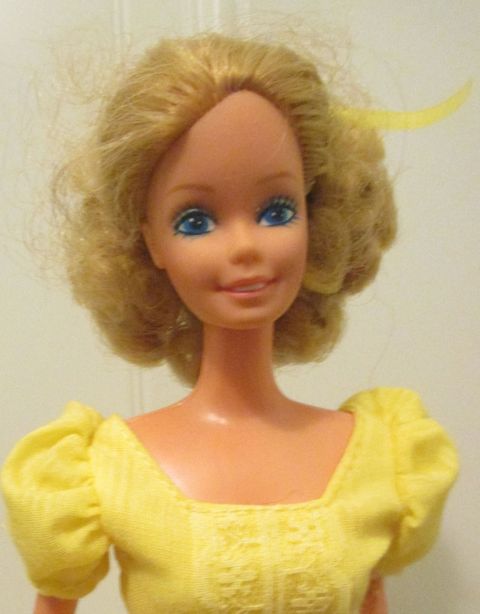 Lip, Toy, Yellow, Hairstyle, Chin, Forehead, Doll, Shoulder, Joint, Style, 