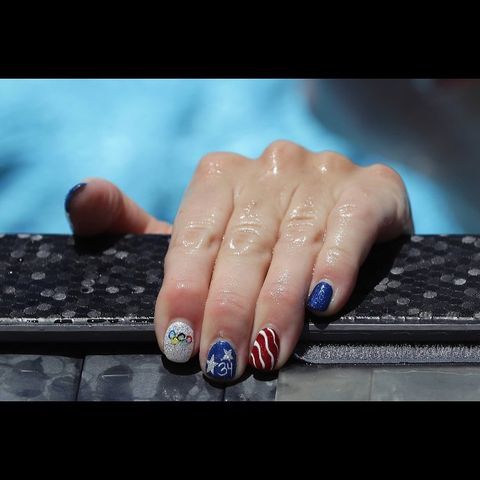 <p>Let's kick this off with a literal nail look worn by an actual Olympic gold medalist, Allison Schmitt. To get her Team USA manicure, paint each nail with a glitter base and use a thin brush to paint the details. <em></em></p><p><em>Design by </em><a href="https://www.instagram.com/p/BH_ydFdD3i1/" target="_blank">@lovethisnailgirl</a><br></p>