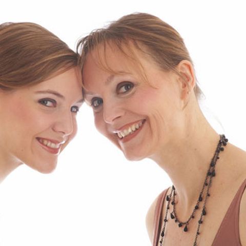 mother and daughter smiling and close together