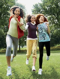 girls running on grass