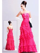 pink prom dress with ruffles and bow