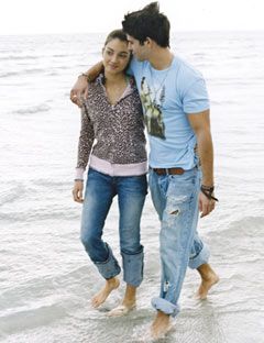 guy and girl walking on the beach
