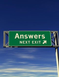 road sign that says answers next exit