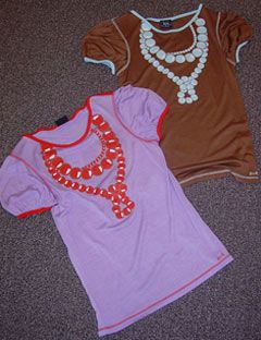 two tee shirts with printed necklaces