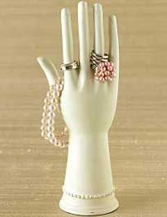 white hand shaped jewelry rack
