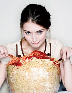 girl eating giant bowl of pasta marinara