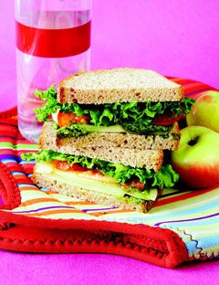 sandwich with water bottle and apples
