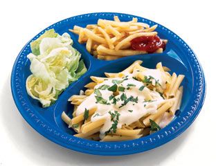 plate of fries pasta and lettuce