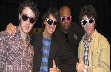 Jonas Brothers and Body Guard "Big Rob" wear the sunglasses we gave them