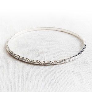 Jewellery, Photograph, Metal, Body jewelry, Circle, Bracelet, Still life photography, Natural material, Silver, Ring, 