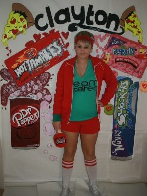 Human body, Jersey, Logo, Uniform, Coca-cola, Active shorts, Sports jersey, Carbonated soft drinks, Cola, Confectionery, 