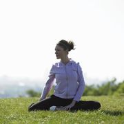 People in nature, Sitting, Grassland, Knee, Active pants, Grass family, Exercise, Meditation, Physical fitness, Meadow, 