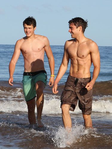 zac and dylan efron at the beach