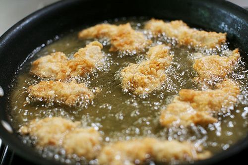 Chicken Strips Or Nuggets Being Deep-fried In A Cast-iron Frying Pan Stock  Photo, Picture and Royalty Free Image. Image 34218325.