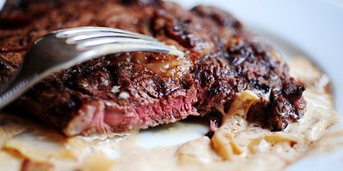 Grilled Ribeye Steak with Onion-Blue Cheese Sauce