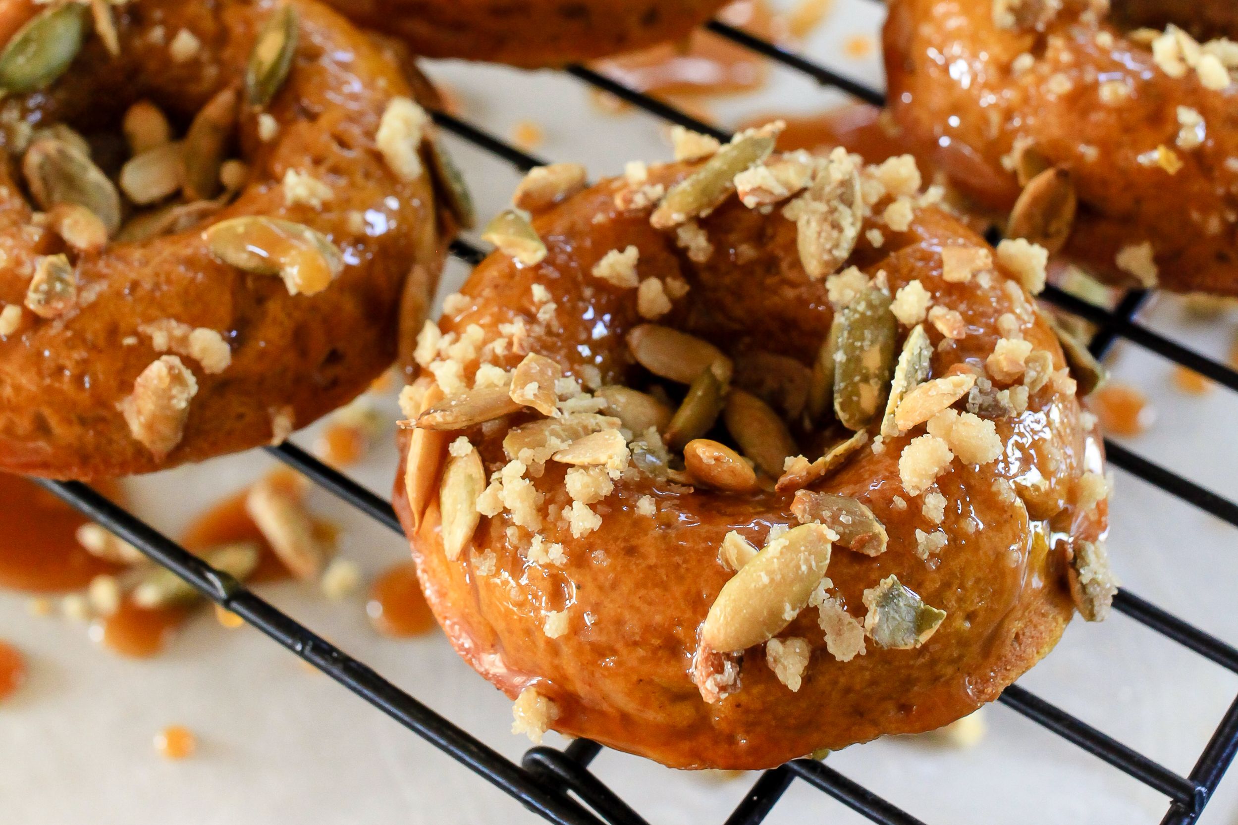 Pumpkin Spiced Donuts with Bourbon Caramel Glaze