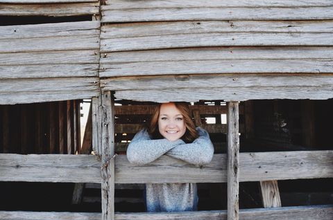 Wood, Happy, Winter, Tooth, Flash photography, Shack, Log cabin, Sweater, Lumber, Child model, 
