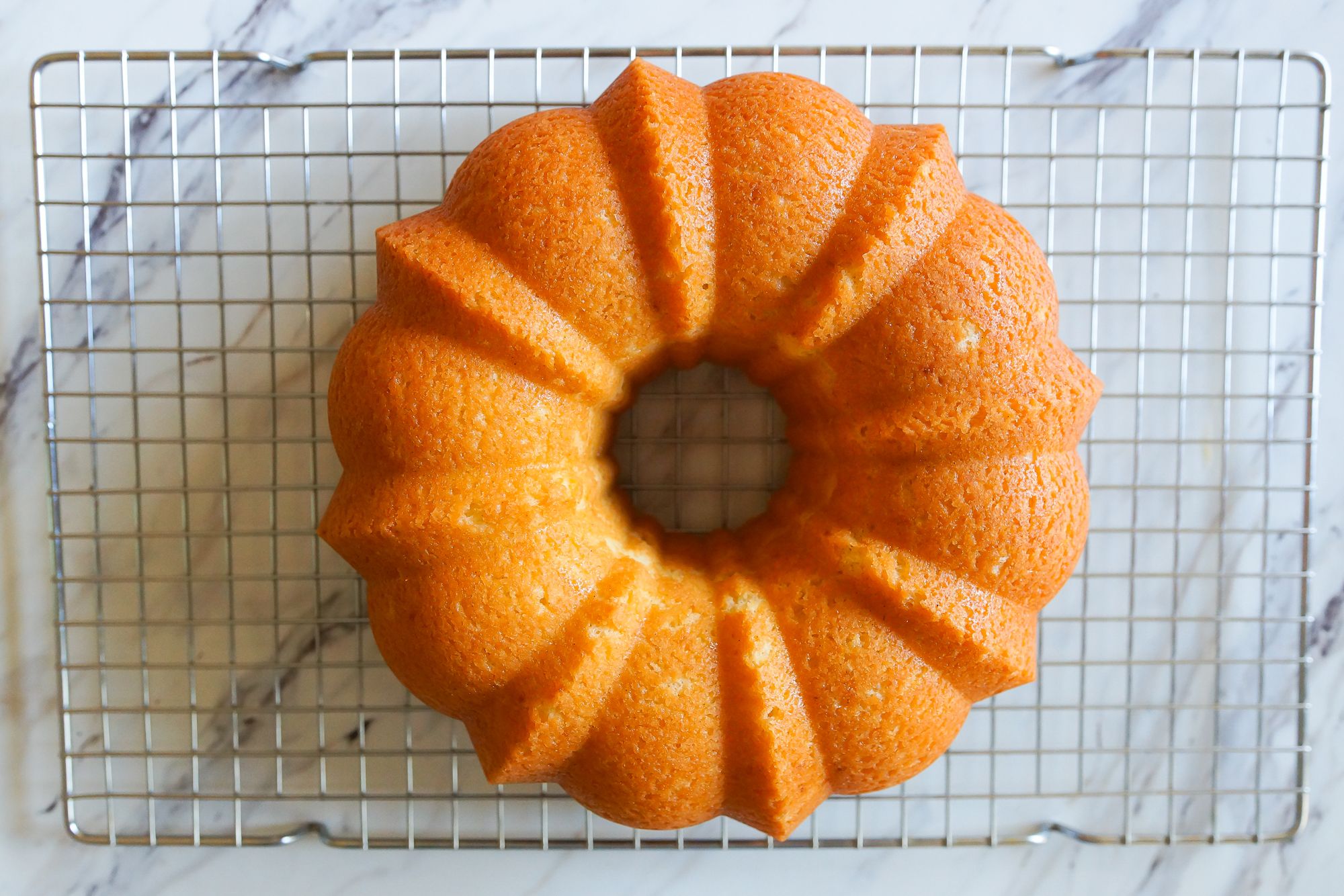 https://hips.hearstapps.com/thepioneerwoman/wp-content/uploads/2018/12/Tips-for-Baking-with-a-Bundt-Pan-cake-baked.jpg