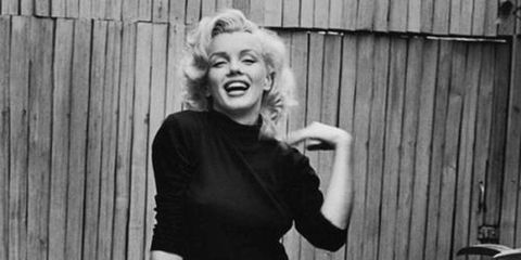 When you picture Marilyn Monroe, it's likely you envision her baring skin in a dripping sequin gown. However, when the blonde bombshell wasn't illuminating the screen or painting the town red, she was cozied up in classic American staples. Most often you could find Monroe in a fitted turtle neck or low-cut blouse, paired with a neutral pair of trousers and loafers. The key to keeping her basic look refined was the tailoring on each of the pieces, as they accentuated her famous curves.
