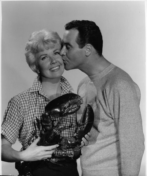 Doris Day is kissed by Jack Lemmon as she holds a lobster in a scene from the film 'It Happened To Jane', 1959. (Photo by Columbia Pictures/Getty Images)