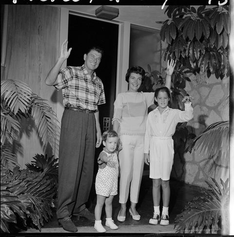 People, Human body, Photograph, Standing, Child, Snapshot, Vintage clothing, Family, Curtain, One-piece garment, 