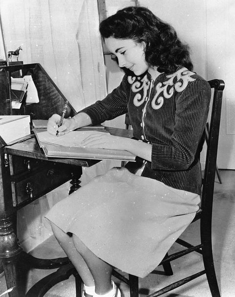 <p>At her writing desk in 1945. </p>