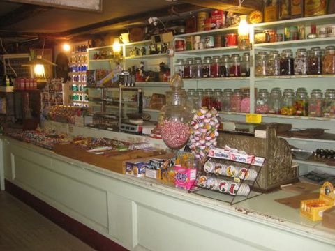 Lighting, Retail, Sweetness, Light fixture, Bottle, Convenience store, Confectionery, Decoration, Trade, Marketplace, 