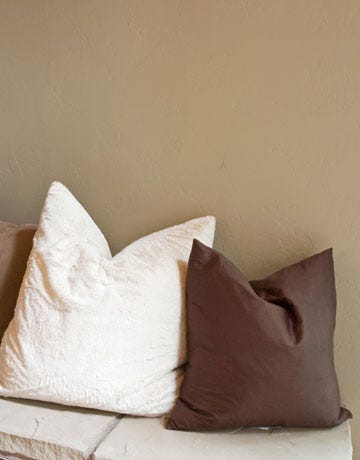 karate chopped pillows on a ledge