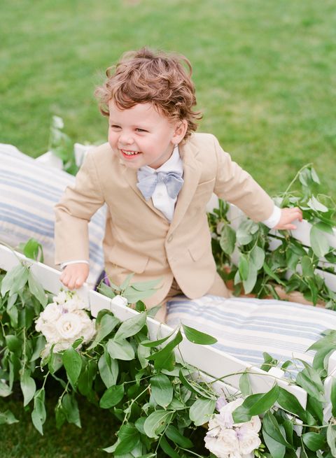 Mouth, Petal, Flower, Happy, People in nature, Child, Shrub, Baby & toddler clothing, Sitting, Flowering plant, 