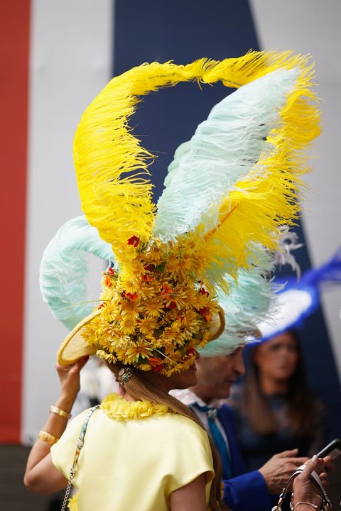 Yellow, Tradition, Costume, Artist, Ritual, Performance art, Festival, Natural material, Carnival, Feather, 