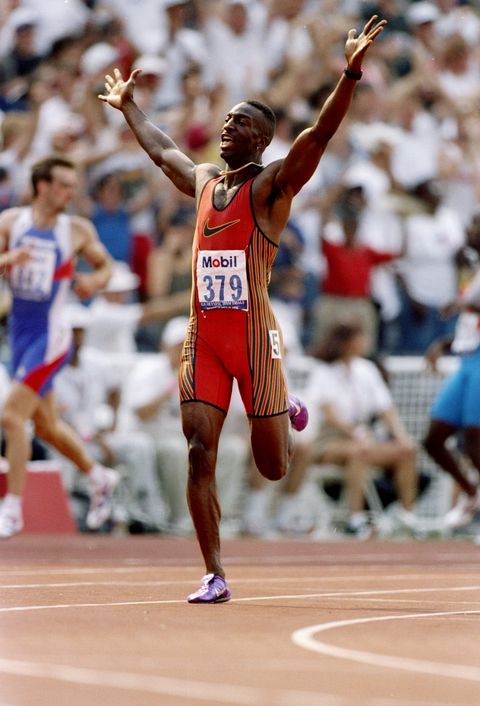 23 Jun 1996: Michael Johnson holds his arms in the air after setting a new world record in the 200 meter race during the United States Olympic Team Trials at Olympic Stadium in Atlanta, Georgia. Mandatory Credit: Andy Lyons /Allsport