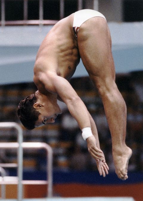 The American Greg Louganis shows his winning form during the men's springboard preliminary, 19 September 1988 at the Seoul Olympic Games. Louganis went on to win a gold medal in the event to retain his Olympic title. (FILM) AFP PHOTO (Photo credit should read RON KUNTZ/AFP/Getty Images)