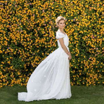 Yellow, Petal, Dress, Flower, People in nature, Formal wear, Gown, Wedding dress, Bridal clothing, Shrub, 