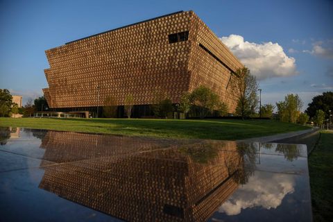 Reflection, Reflecting pool, Brick, Symmetry, Tourist attraction, Water feature, Headquarters, Historic site, Landscaping, Brickwork, 