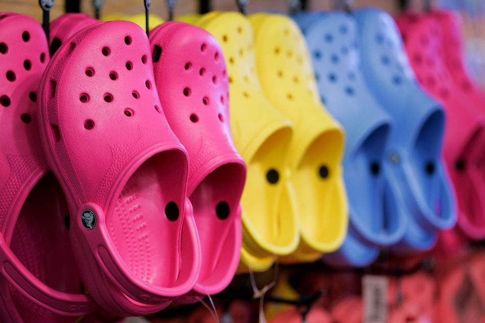Pink, Red, Footwear, Climbing hold, Yellow, Sports gear, Slipper, Shoe, Colorfulness, Headgear, 