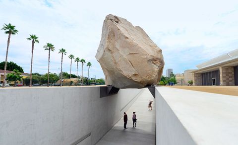 Rock, Concrete, World, Boulder, Composite material, Arecales, Pedestrian, Palm tree, Urban design, Shadow, 