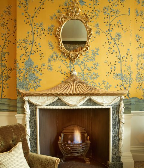 Yellow, Hearth, Room, Fireplace, Interior design, Living room, Wall, Wallpaper, Furniture, Ceiling, 