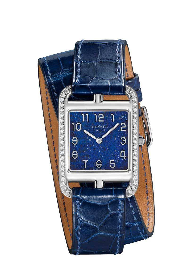 Blue, Product, Brown, Watch, Analog watch, Glass, Watch accessory, Font, Electric blue, Fashion accessory, 
