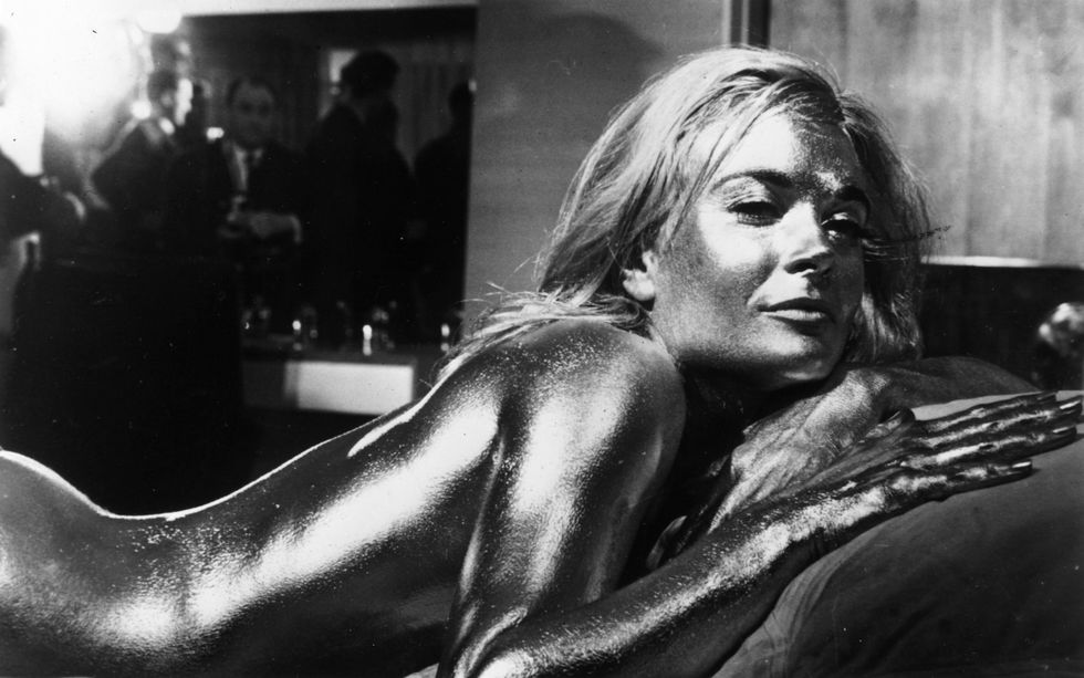 English actress Shirley Eaton covered in gold in the James Bond film 'Goldfinger', directed by Guy Hamilton and starring Sean Connery.   (Photo by Keystone/Getty Images)
