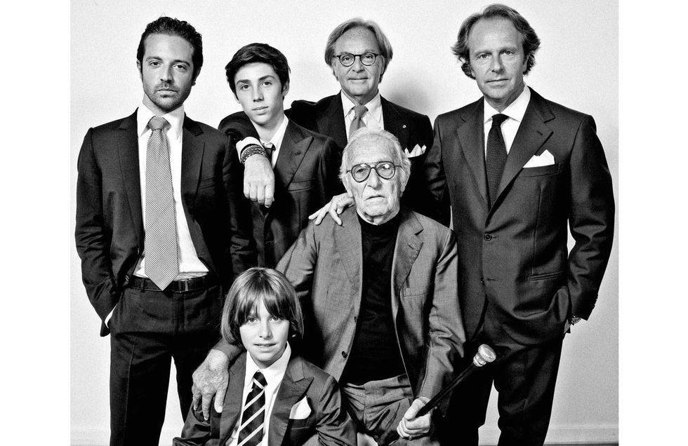 The Della Valle family is known for Tod's, a company that began as a cobbler shop under Filippo Della Valle in the 1920s and is now a global empire, but its interests (and investments) range far and wide. Brothers Diego and Andrea (chairman and vice chairman, respectively) own the soccer team in Florence. Diego is also part owner of Saks, sits on the board of LVMH, and is footing the $34 million bill to restore the Colosseum in Rome. His involvement in cultural and government affairs has made him something of a standard-bearer for Italy, a fact that was magnified during his recent public spat with Fiat president John Elkann, another Italian magnate, on the work ethic of young Italians. Diego's son, 39-year-old Emanuele, is the founder of New York–based Mediabend Capital, a company (which the family has invested in) that includes the shoppable web publication Lifestyle Mirror.Dorino Della Valle, with sons Diego (second from right) and Andrea (right) and grandsons, 2011.