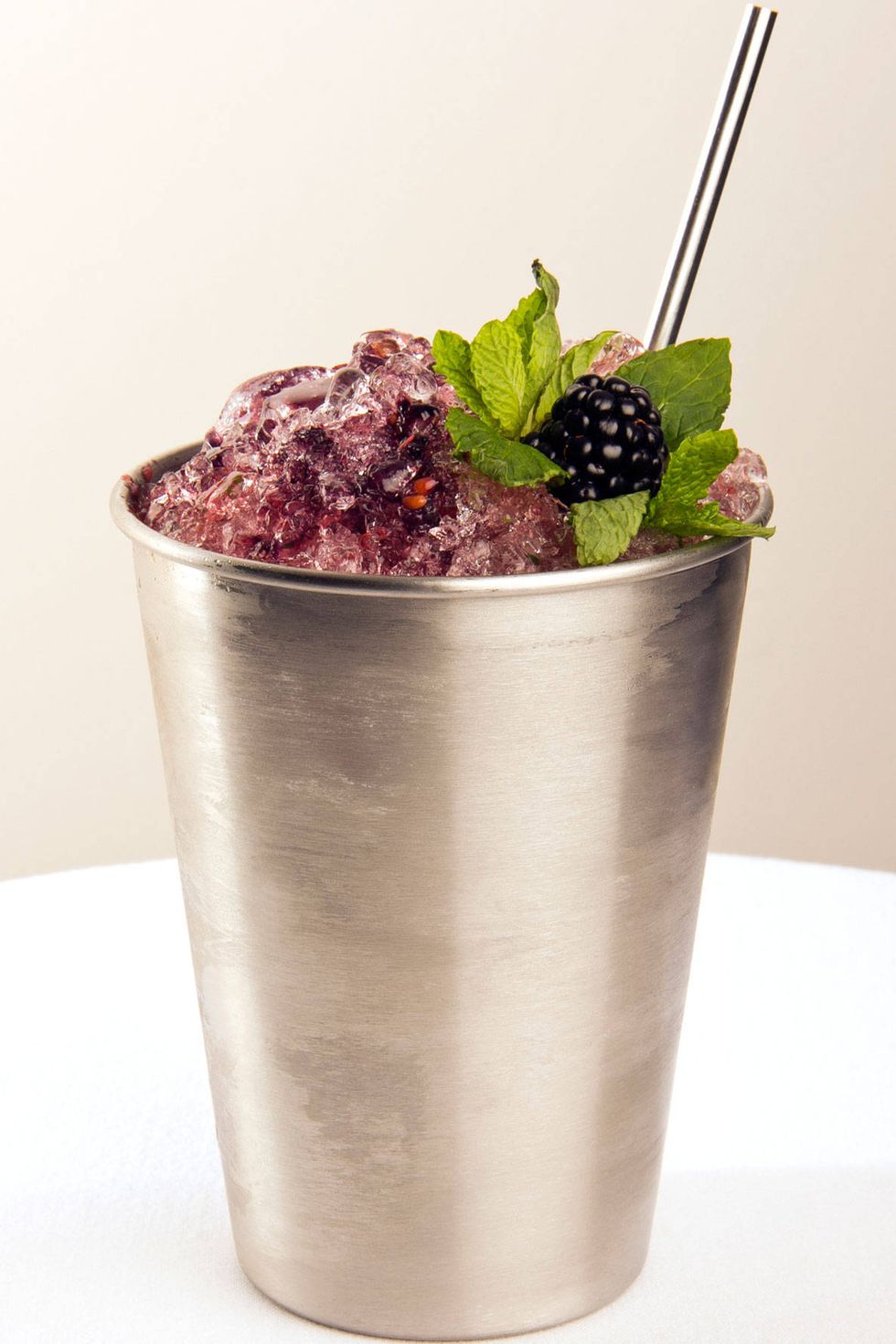 Juleps may be most closely associated with the Kentucky Derby and as much as we love the traditional mint version (check out our guide to the Ultimate Mint Julep here), in the summer it's fun to try it with fruit added to the mix. Bay Kitchen Bar, in East Hampton, NY, serves a blackberry mint julep that sounds delicious. "We make it with fresh, local blackberries and mint that showcases the flavors of Long Island while perfectly complimenting our menu," says Adam Miller, managing partner and beverage program director.Ingredients2 oz Bulleit Bourbon1/2 oz Chambord3/4 oz Fresh lime juice1/2 oz Demerara syrup5 muddled blackberries6 mint leavesInstructionsMix all ingredients in a shaker and pour over crushed ice. Garnish with a sprig of mint and a blackberry.