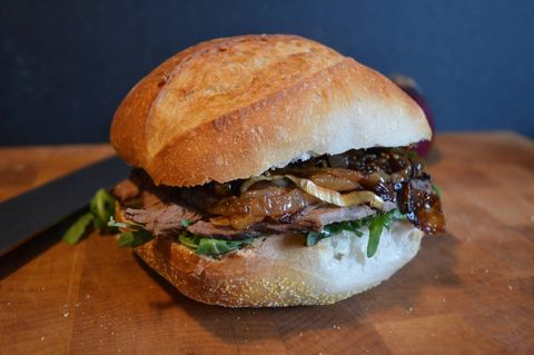 Smooth on the seedy mustard on both sides of roll or baguette, then layer on the caramelized onions, some arugula or greens dressed in a touch of olive oil, and steak. Slice in half and serve with a cold beer or red wine.