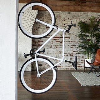 Soporte vertical para bicicletas montado en la pared