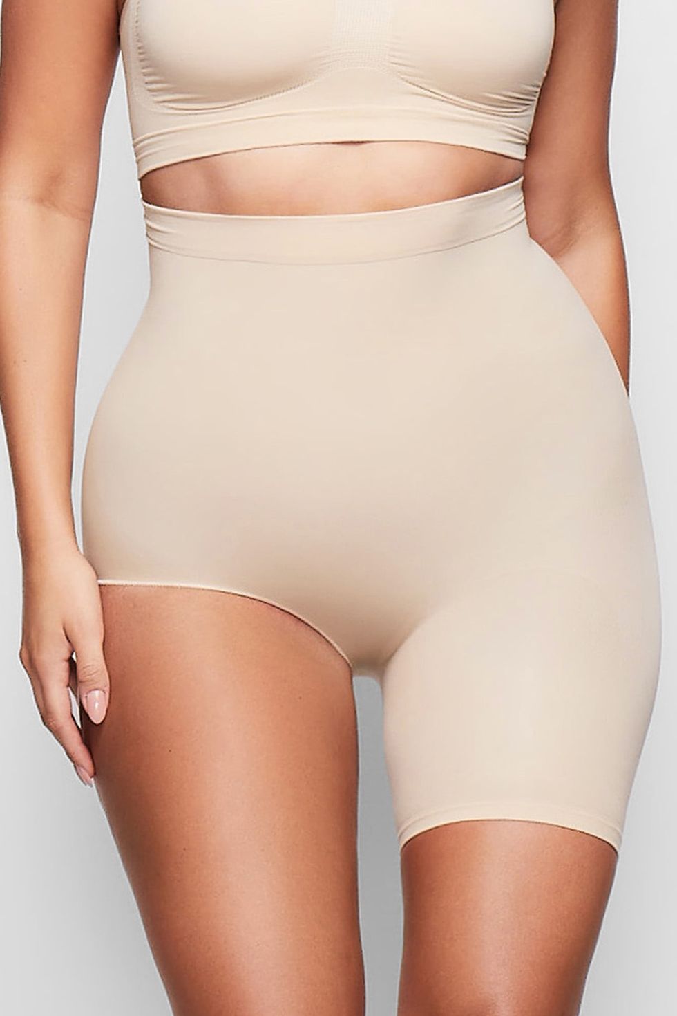 Kim Kardashian showcases her ample bust in pieces from her upcoming SKIMS  Body Basics line