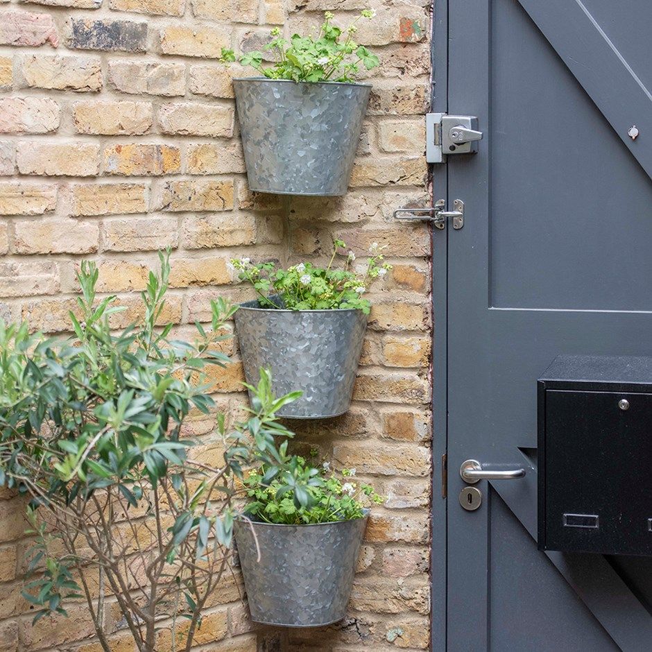 Set of three galvanised corner wall planters