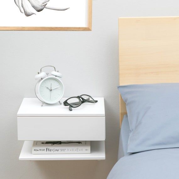 white floating bedside cabinets