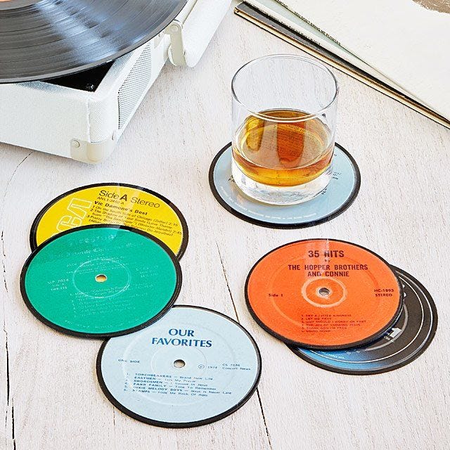 https://hips.hearstapps.com/vader-prod.s3.amazonaws.com/1586800800-upcycled-record-coasters-1586800781.jpg?crop=1xw:1xh;center,top&resize=980:*