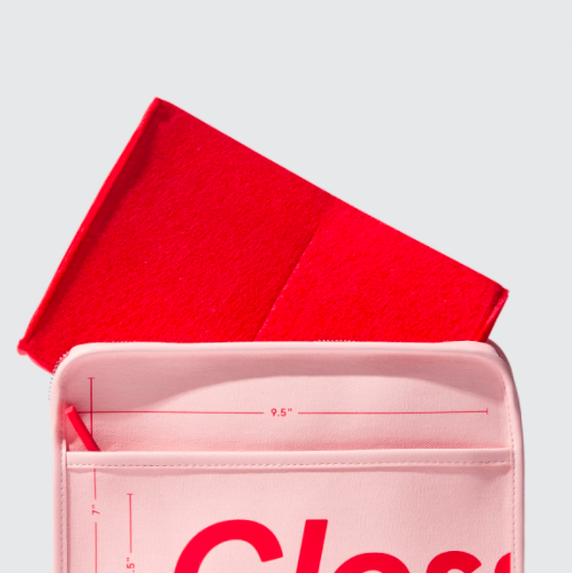 My Glossier stash in my original pink makeup bag without the