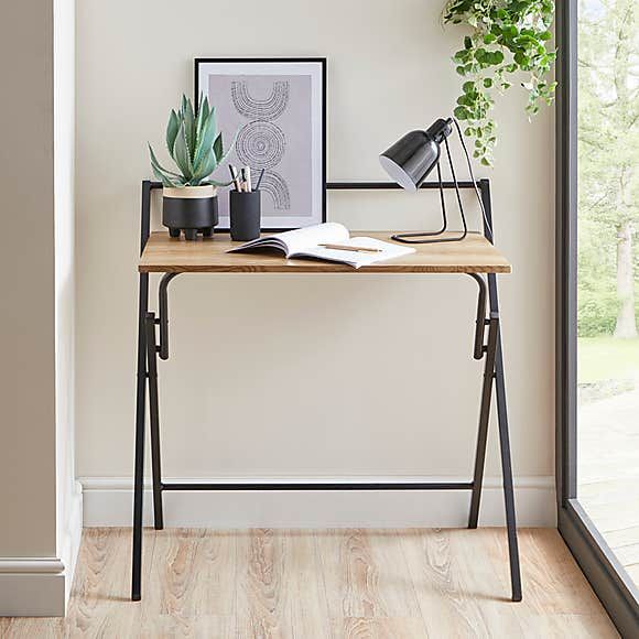 Standing desk outlet that folds