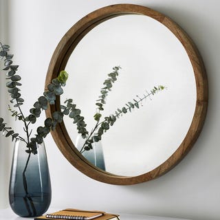 Mirror with a light wooden frame